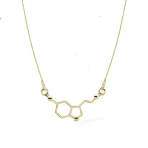 Förgyllt halsband med serotoninmolekyl