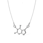 Silverhalsband "Silverhalsband molekylen för Choklad" med ett hänge format som en chokladmolekyl med en hexagonal ring och små sfärer i varje hörn.