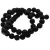 Black matte bead bracelet arranged in a loose coil on a white background.