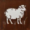 White cutout silhouettes of sheep arranged along a rusted metal surface; the negative space shows several sheep figures against the brown, textured background.