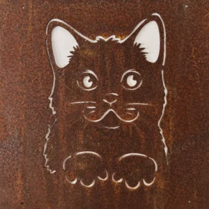 Close-up of a heavily rusted metal surface with a white outline drawing of a cartoon butterfly-like shape in the center.