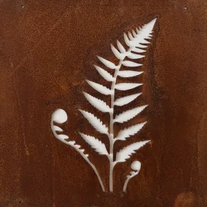White fern leaf cutout on a textured, rusted metal surface.