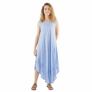 Woman wearing a light blue sleeveless maxi dress with a flowing high-low hem, standing and smiling.